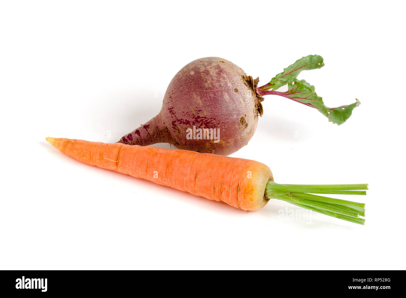 Carrot and beetroot with leaf isolated on white background. Stock Photo