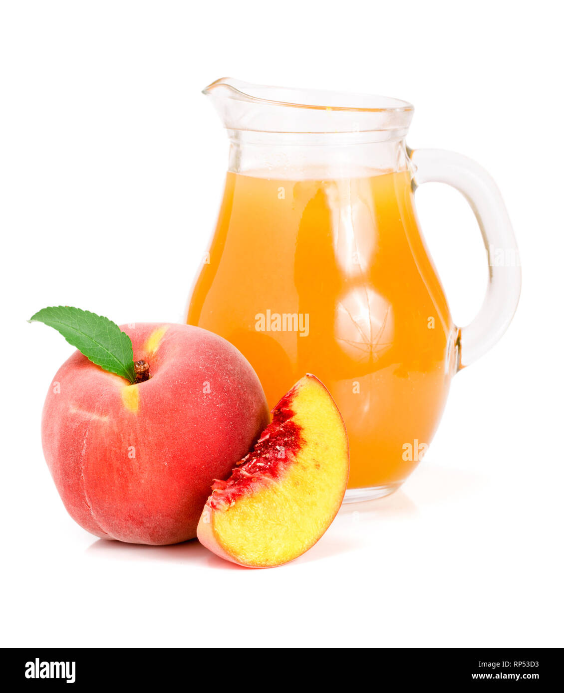 Peach juice in a glass jug isolated on white background. Stock Photo
