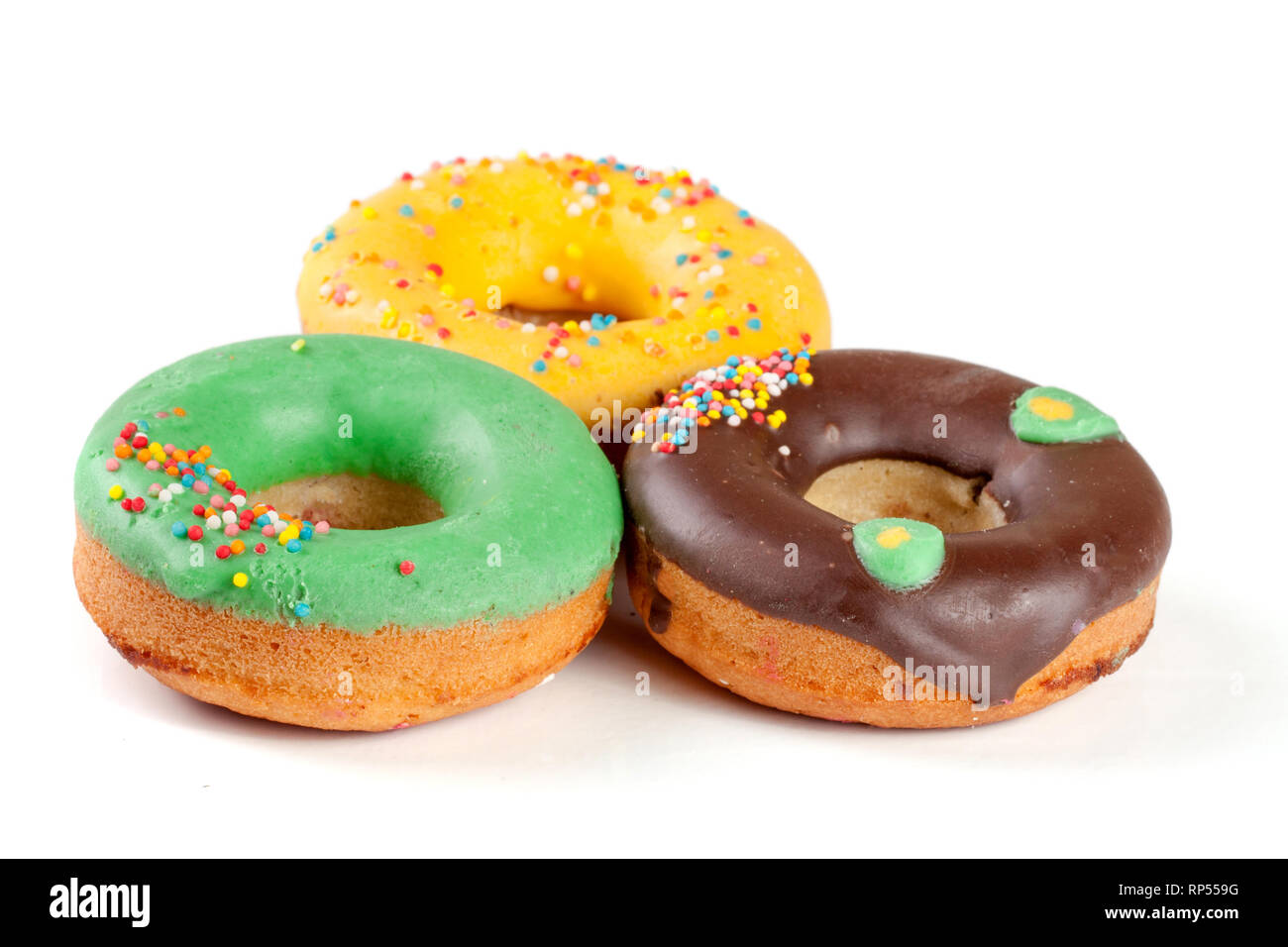 three glazed donut isolated on white background Stock Photo - Alamy