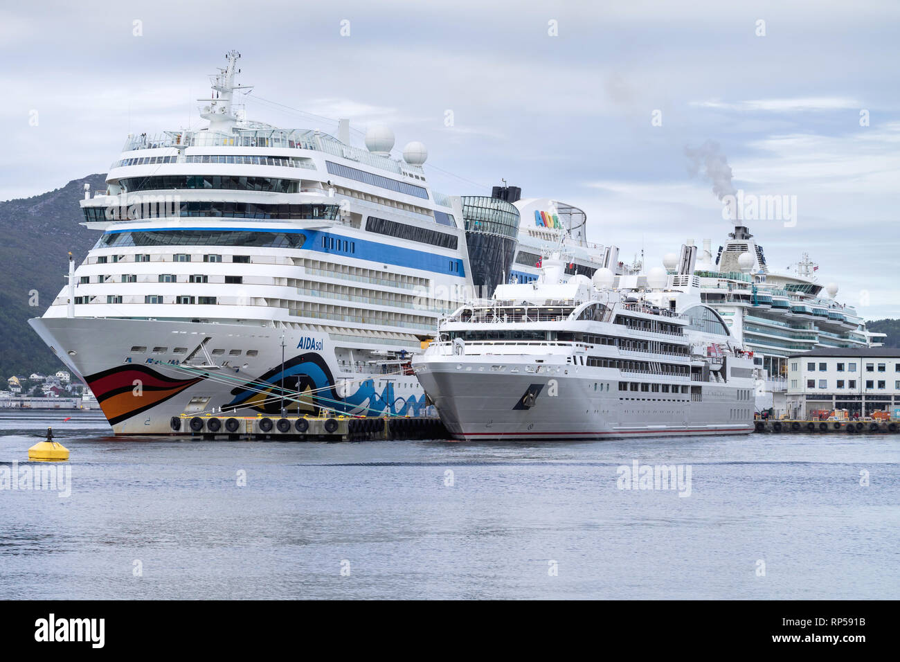 Cruise ships AidaSol, Le Soleal and Serenade of the Seas in Alesund. Alesund is noted for Art Nouveau architecture a popular cruise destination. Stock Photo