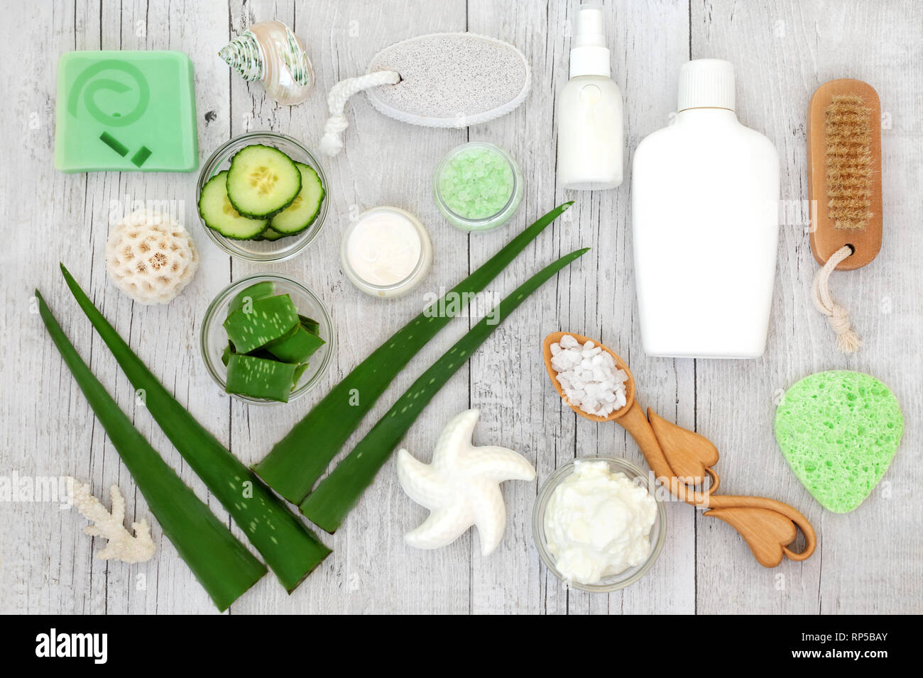 Aloe vera skin care including plant stems, cucumber, yoghurt, moisturiser, facial  cream, body lotion and ex foliating salt scrub Stock Photo - Alamy