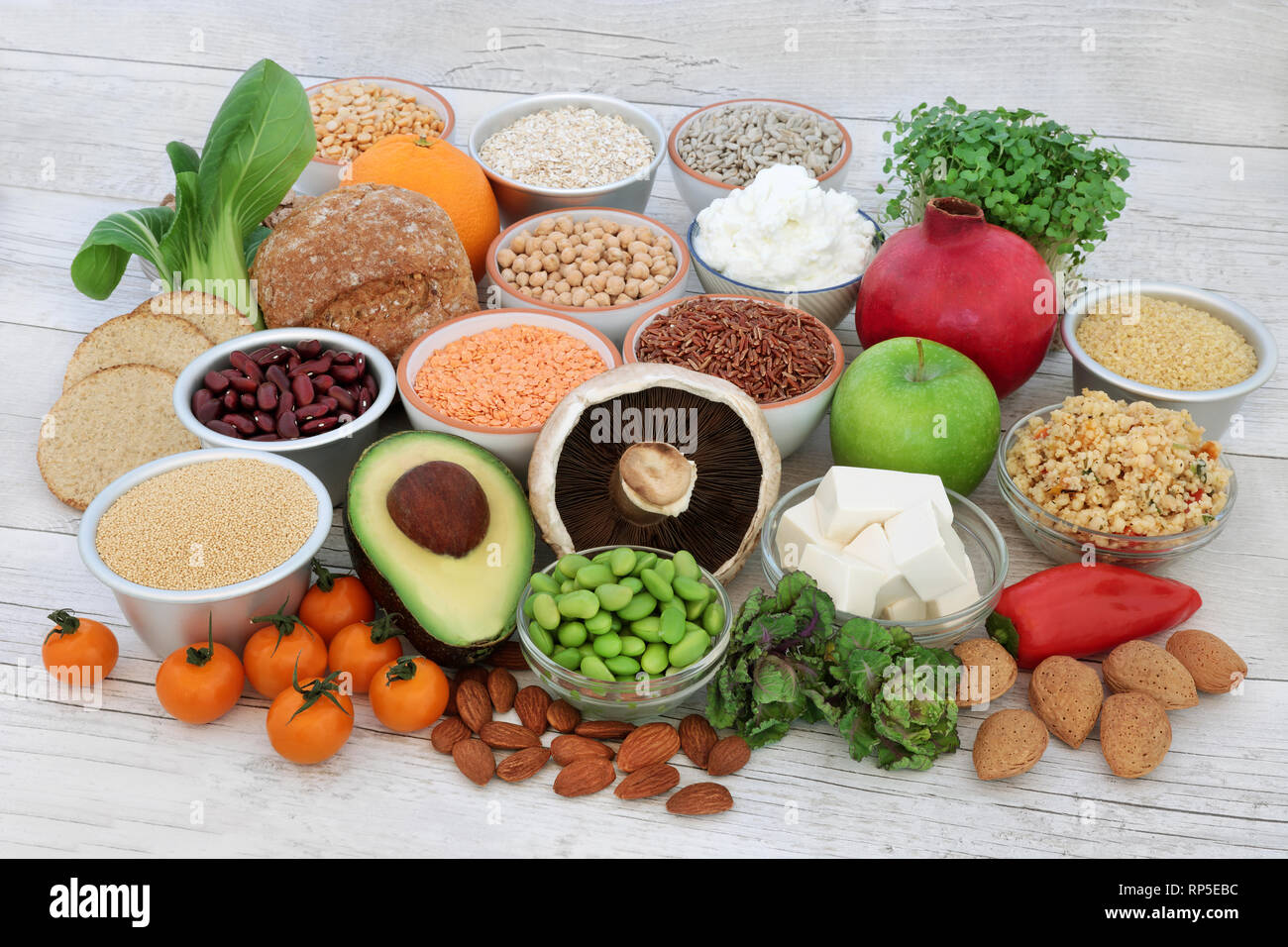 Vegan health food with tofu bean curd, legumes, nuts, seeds, cereals