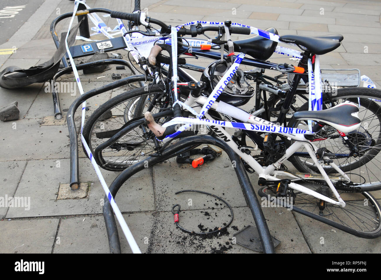 Photography of London bicycle rack and bicycles damaged in an road