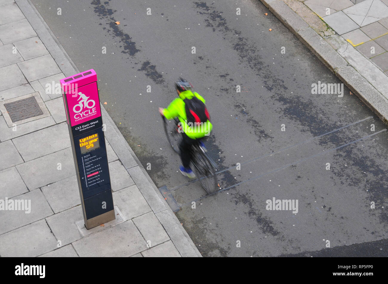 Cyclists ride along the cycle lane on The Cycle Superhighway on Victoria Embankment. Stock Photo