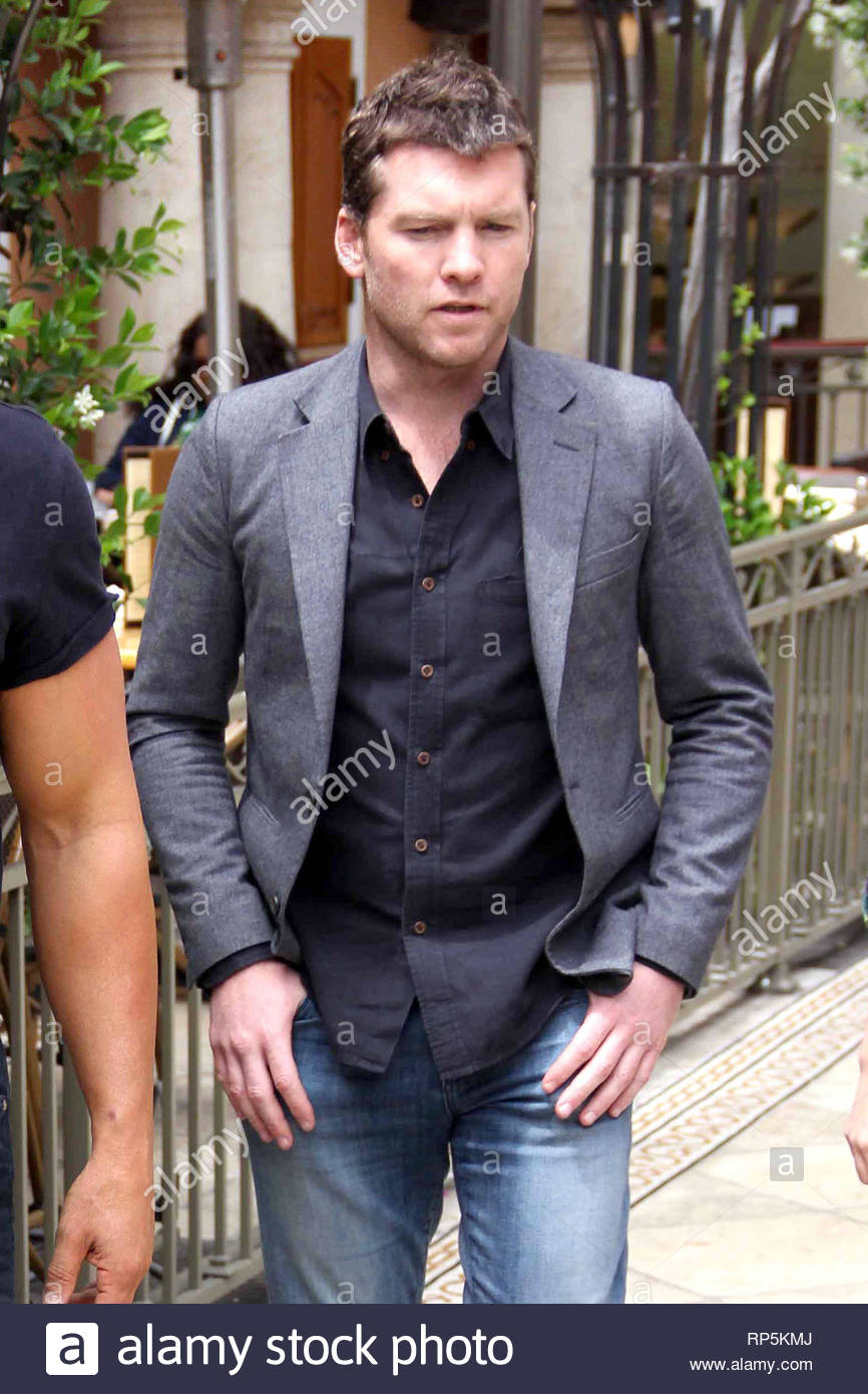 blue jeans black shirt grey blazer
