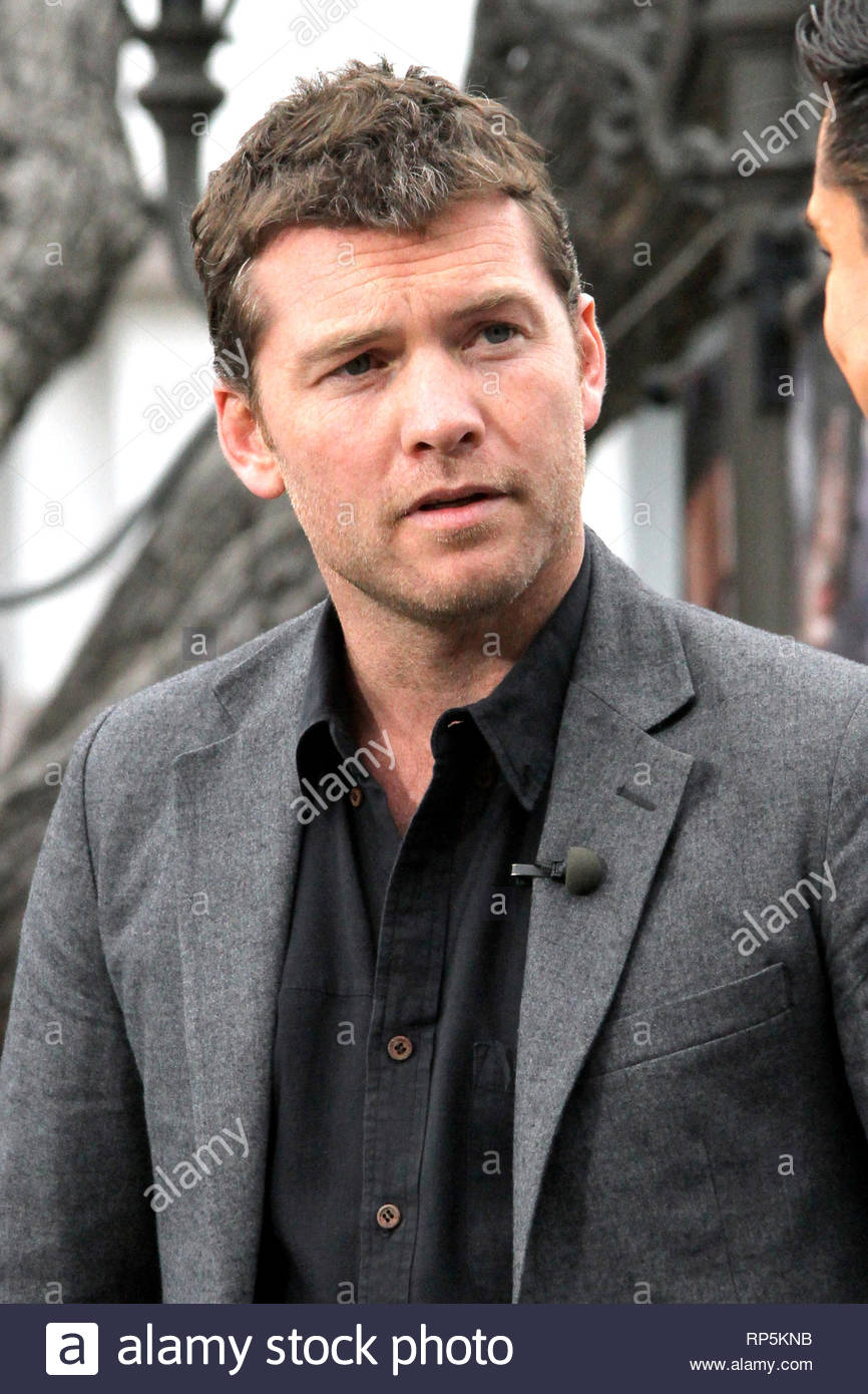 black jeans black shirt grey blazer