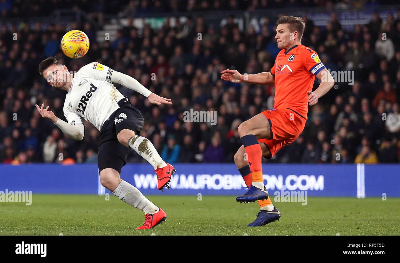 Derby County's Jack Marriott (left) and Millwall's Shaun Hutchinson battle for the ball during the Sky Bet Championship match at Pride Park, Derby. Stock Photo