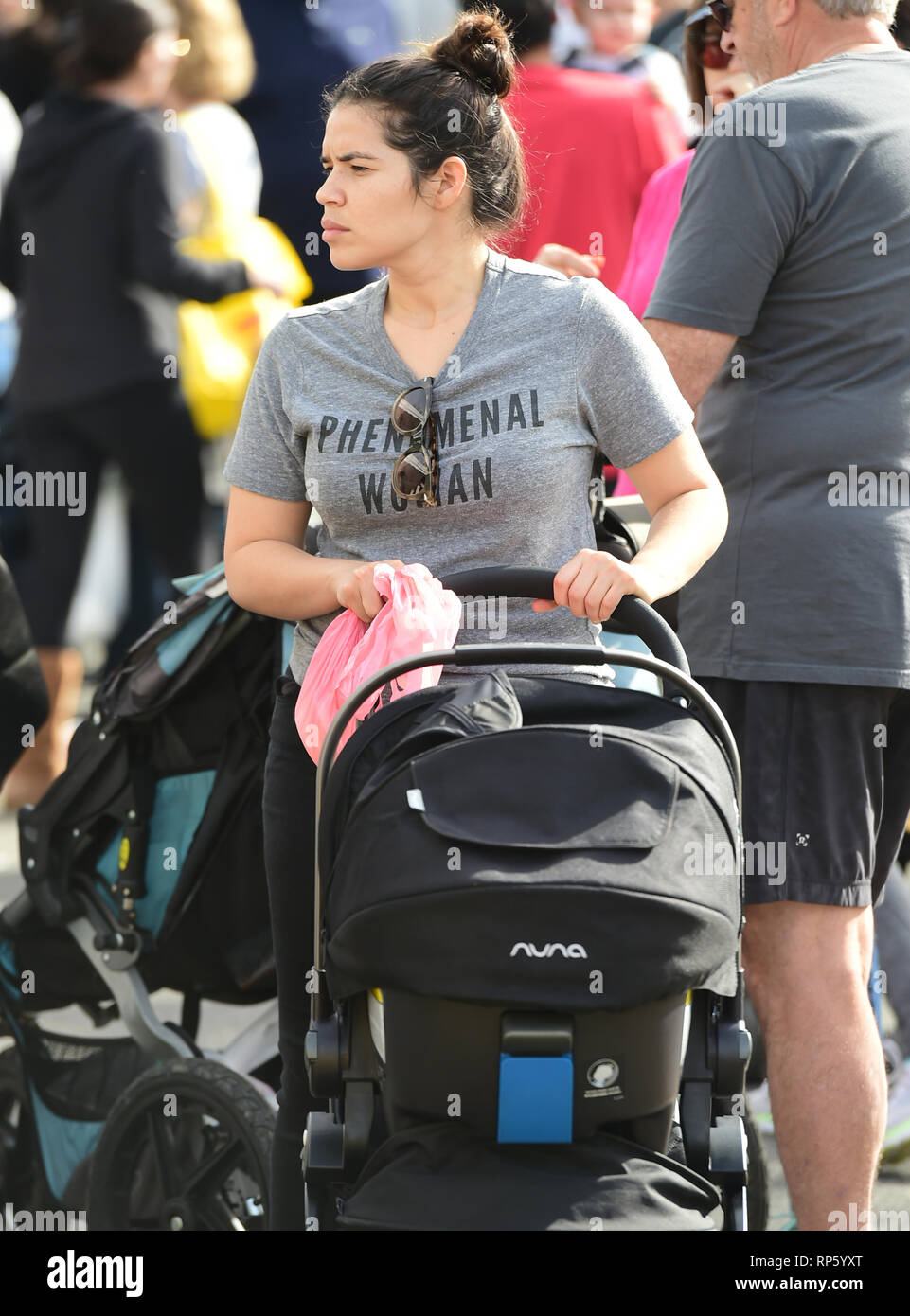 America Ferrera samples Kombucha drinks and peruses the produce at the