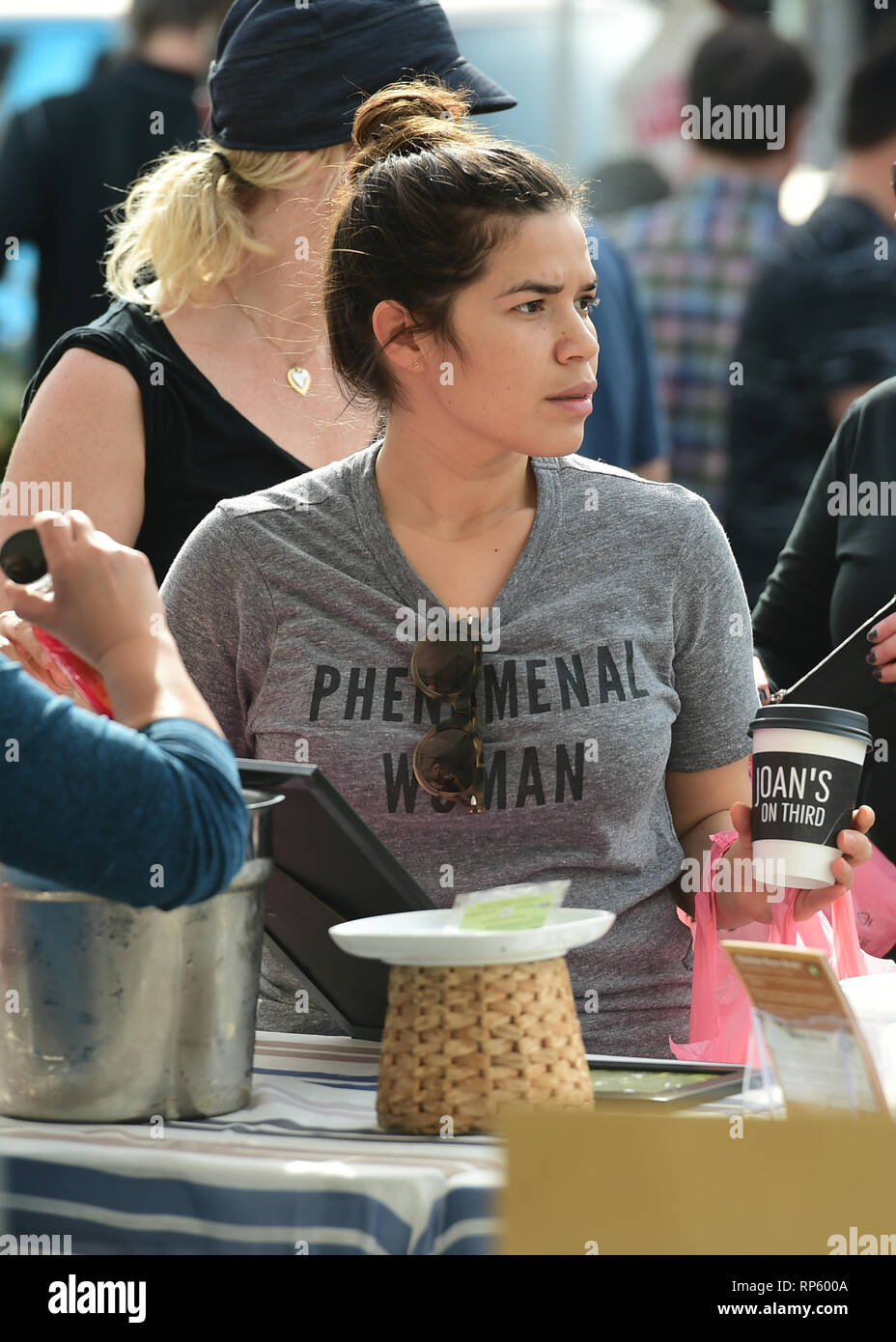 America Ferrera samples Kombucha drinks and peruses the produce at the