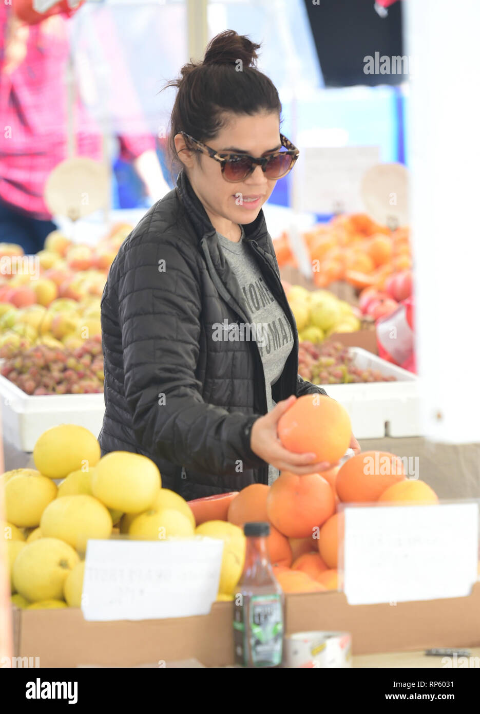 America Ferrera samples Kombucha drinks and peruses the produce at the