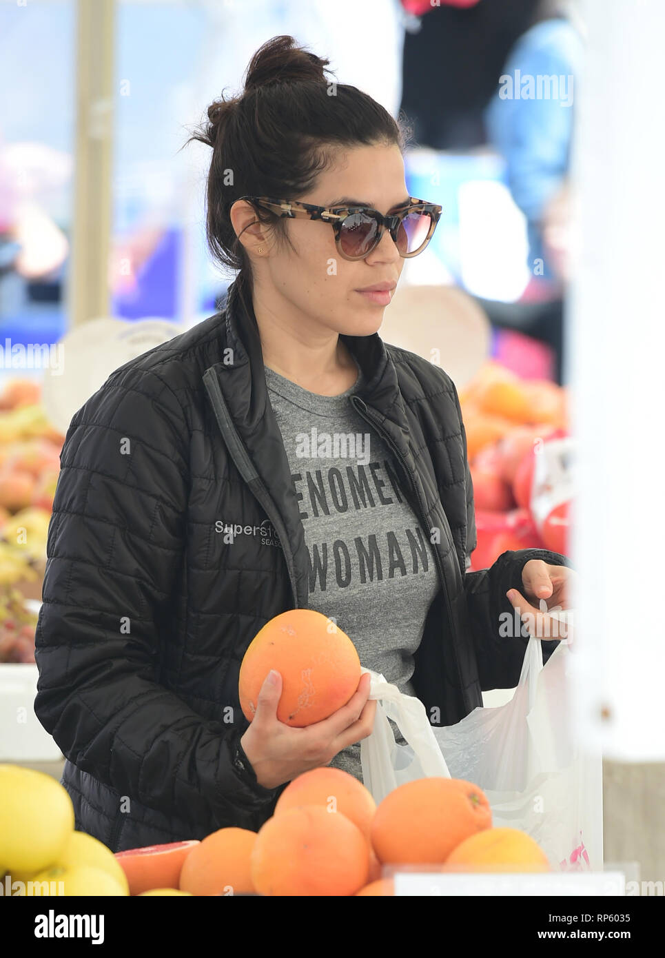 America Ferrera samples Kombucha drinks and peruses the produce at the