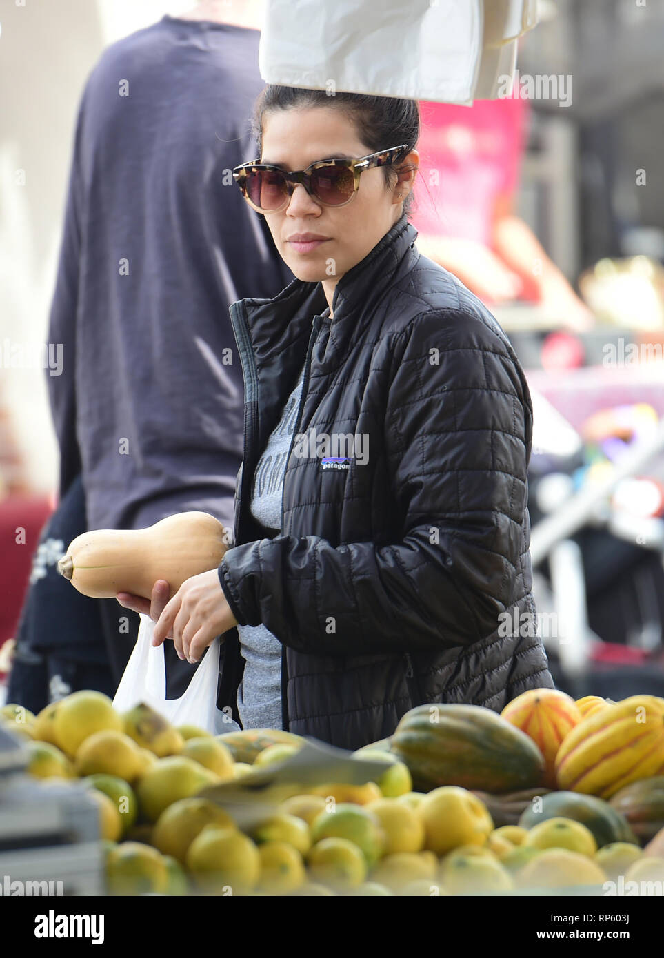 America Ferrera samples Kombucha drinks and peruses the produce at the