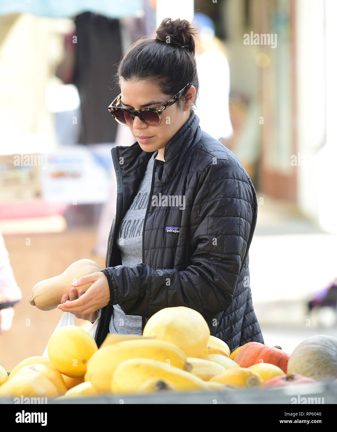 America Ferrera samples Kombucha drinks and peruses the produce at the