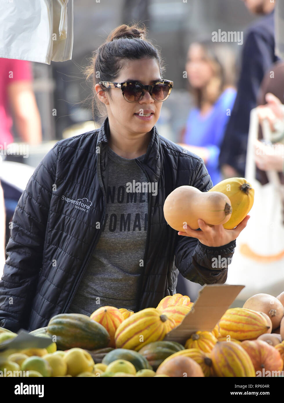 America Ferrera samples Kombucha drinks and peruses the produce at the