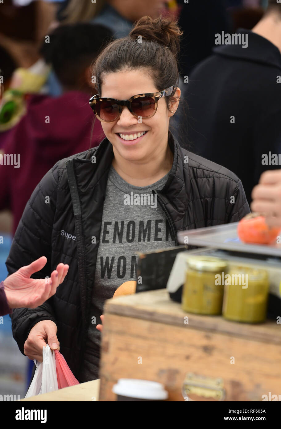 America Ferrera samples Kombucha drinks and peruses the produce at the