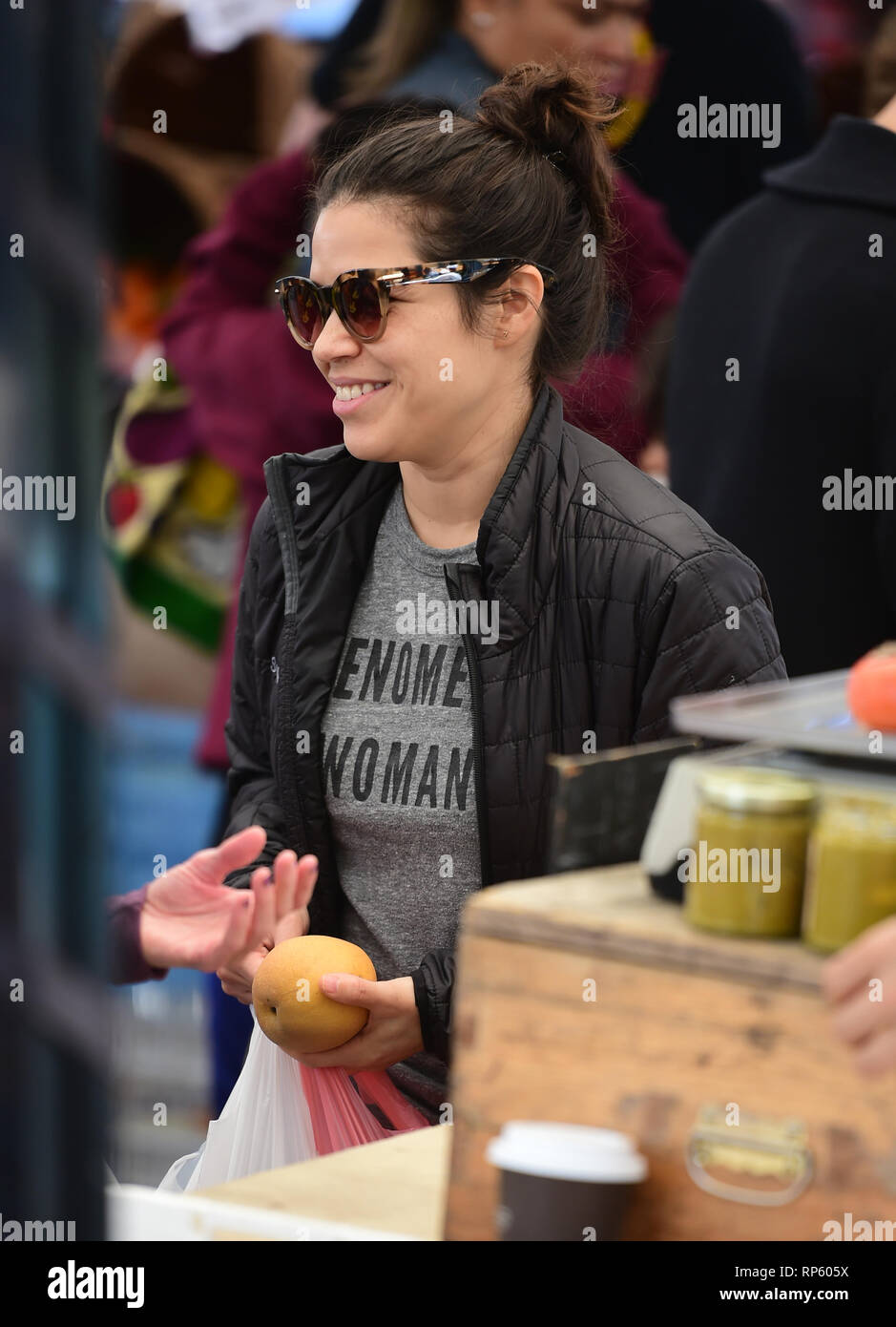 America Ferrera samples Kombucha drinks and peruses the produce at the