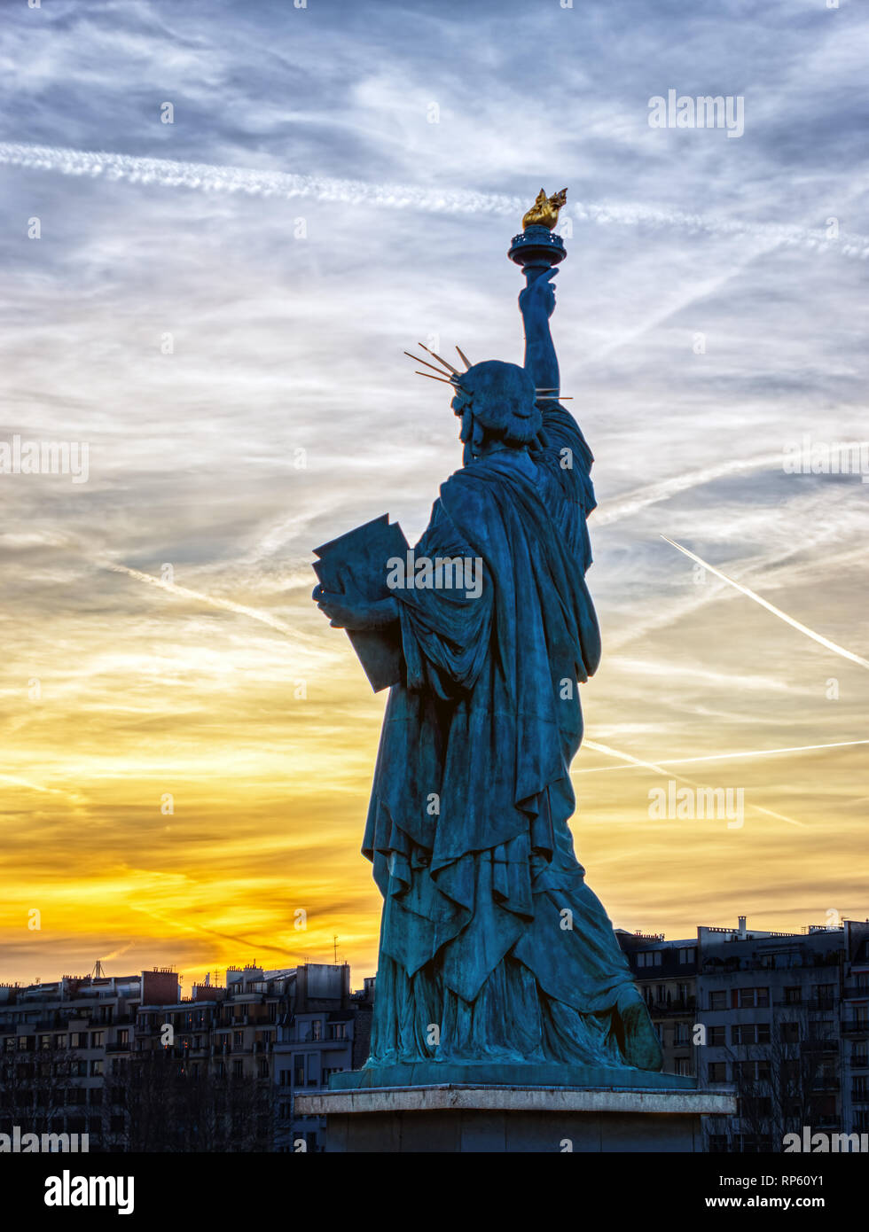 Replica of the Liberty Statue against the sunset in Paris Stock Photo