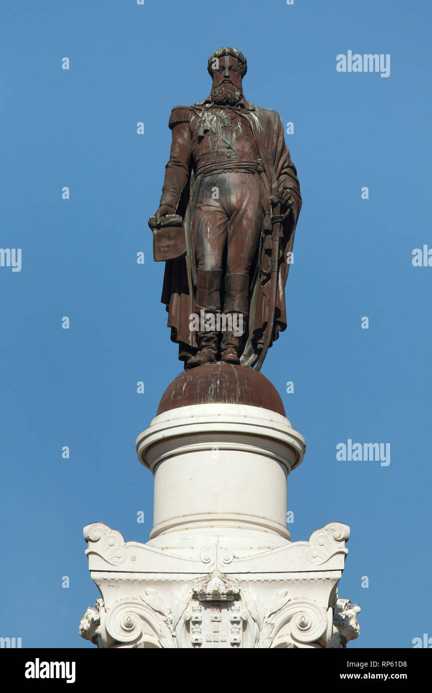 Bronze statue of King Pedro IV of Portugal by French sculptor Élias Robert (1874) topping the Monument to King Pedro IV designed by French architect Gabriel Davioud in Rossio Square (Praça do Rossio) in Lisbon, Portugal. Stock Photo