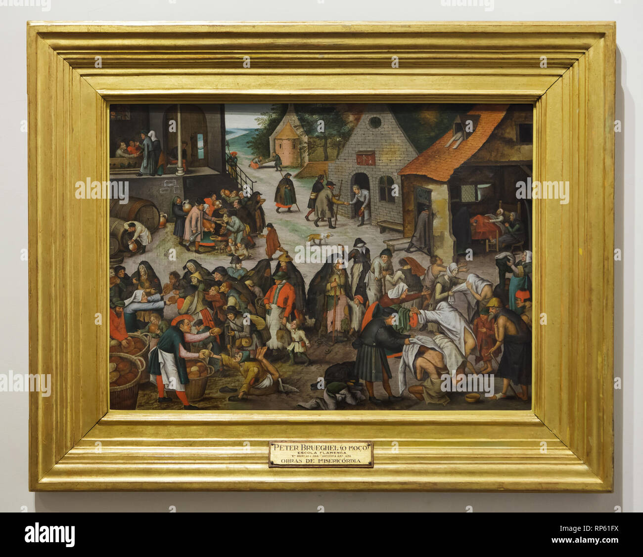 Painting 'Seven Acts of Mercy' by Dutch Renaissance painter Pieter Bruegel the Younger (1600-1605) on display in the National Museum of Ancient Art (Museu Nacional de Arte Antiga) in Lisbon, Portugal. Stock Photo