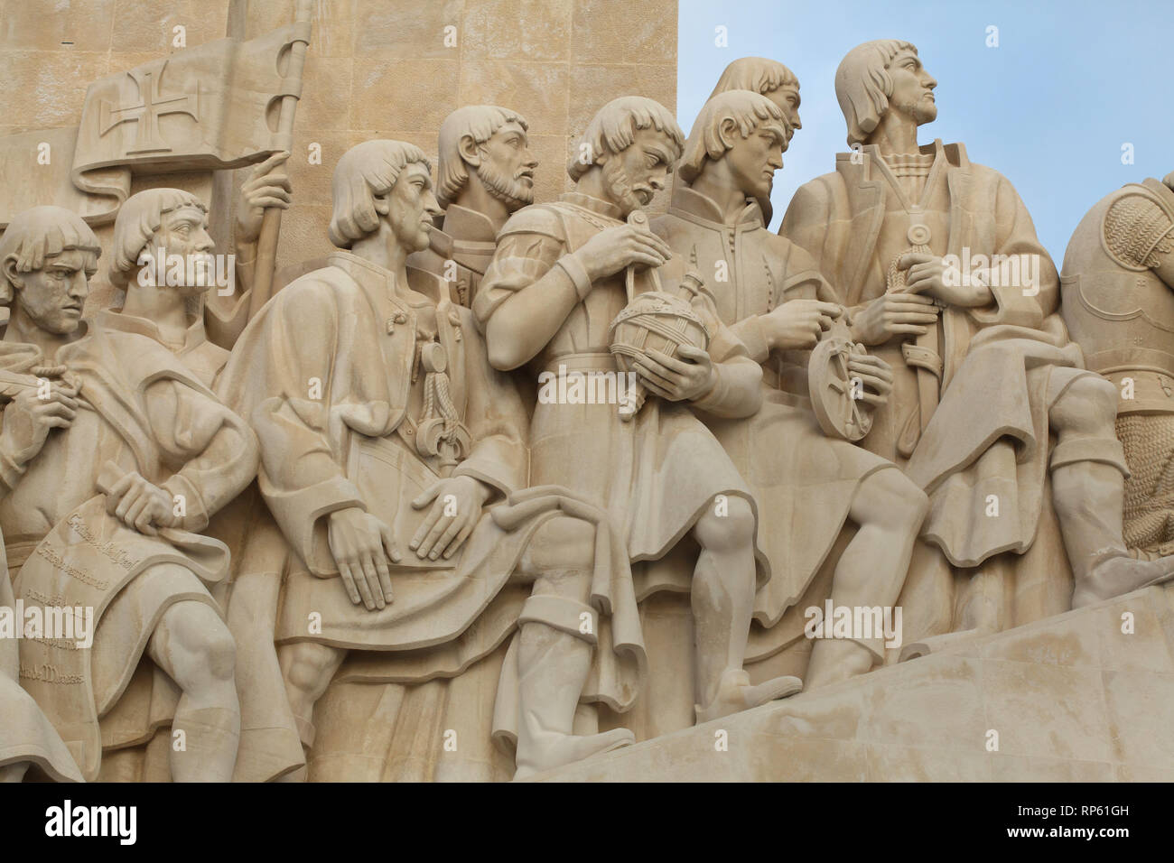 Portuguese chronicler Gomes Eanes de Zurara, Portuguese explorer Pêro da Covilhã, Portuguese cartographer Jácome de Maiorca (Jehuda Cresques), Portuguese navigator Pêro Escobar, Portuguese mathematician Pedro Nunes (depicted with a globe), Portuguese navigator Gil Eanes (depicted with the astrolabe), Portuguese explorer Pêro de Alenquer (depicted in the background) and Portuguese explorer João Gonçalves Zarco (depicted from left to right) on the Monument of the Discoveries (Padrão dos Descobrimentos) designed by Portuguese sculptor Leopoldo de Almeida (1960) on the bank of the Tagus River in B Stock Photo