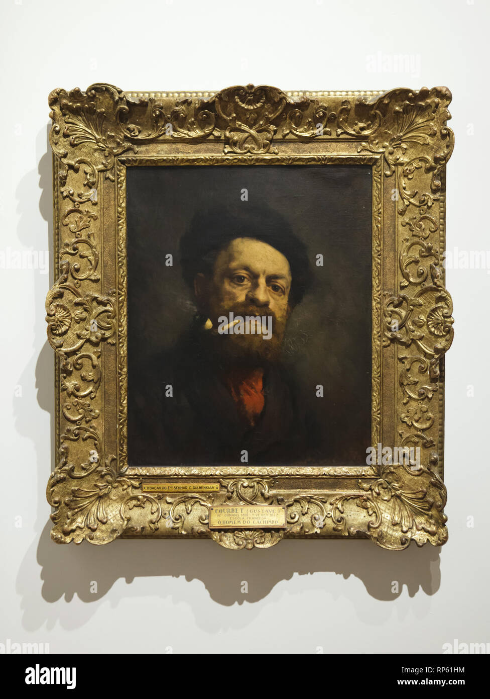 Painting 'Man with Pipe' by French realist painter Gustave Courbet (1868) on display in the National Museum of Ancient Art (Museu Nacional de Arte Antiga) in Lisbon, Portugal. The painting was donated to the museum by British businessman and philanthropist Calouste Gulbenkian in 1950. Stock Photo