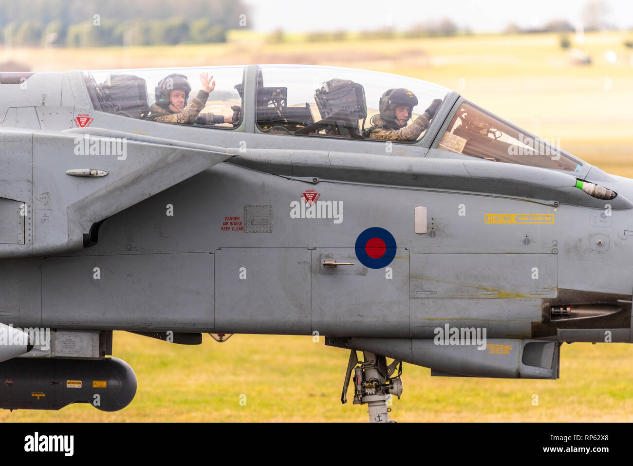 Royal Air Force Panavia Tornado Gr4 fighter jet taxiing back in after taking part in the RAF Tornado Farewell Tour titled FINale. Crew wave to fans Stock Photo