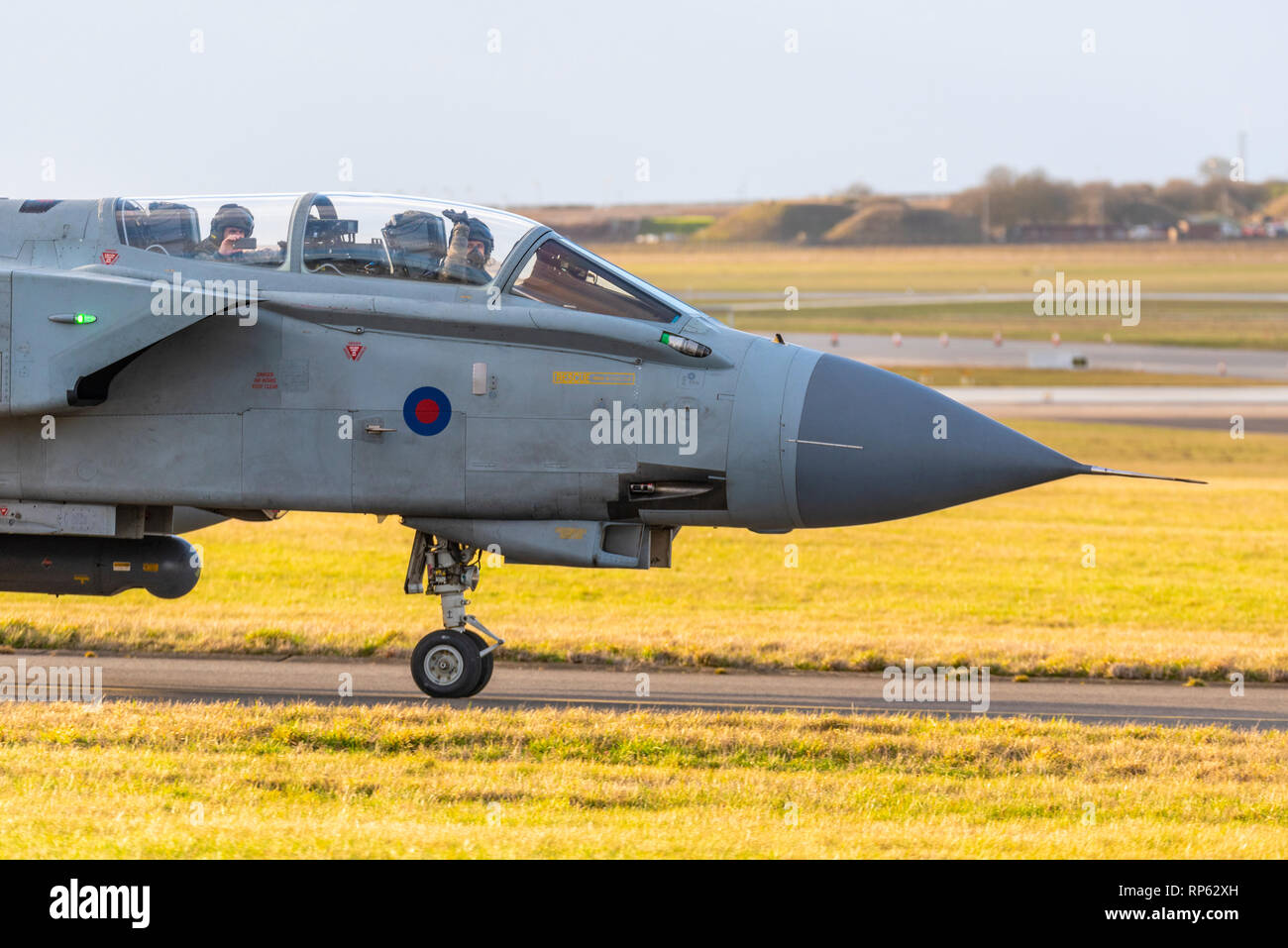 Royal Air Force Panavia Tornado Gr4 fighter jet taxiing back in after taking part in the RAF Tornado Farewell Tour titled FINale. Crew wave to fans Stock Photo