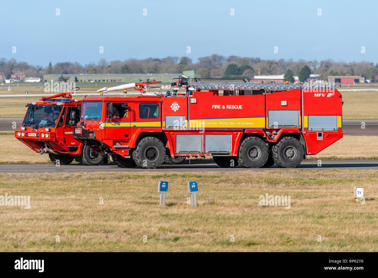 Royal Air Force Fire & Rescue emergency vehicles at RAF Marham. Fire engine. Fire truck on airfield. MFV2 Stock Photo