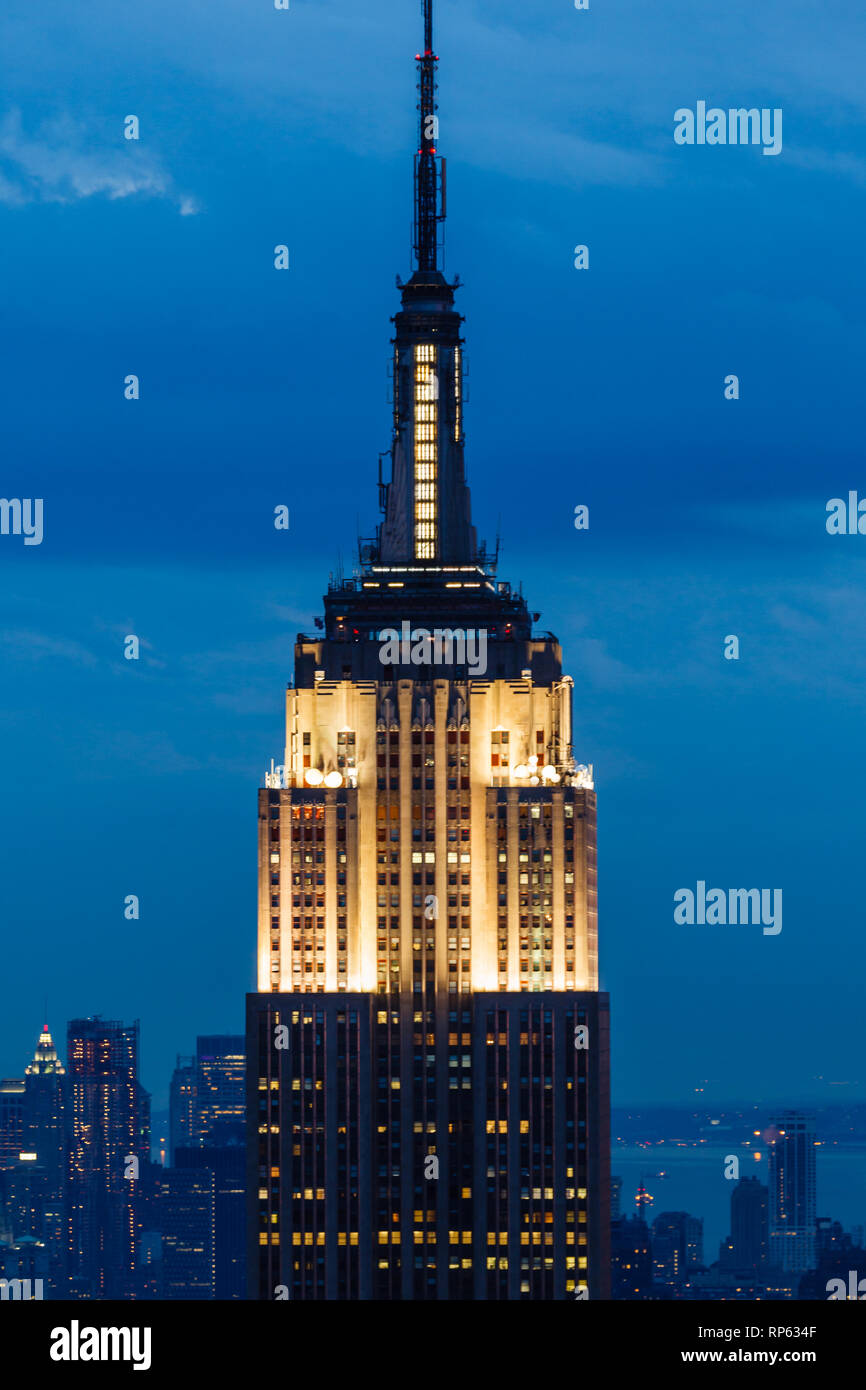 Top Floors Of Empire State Building Tower Illuminated In