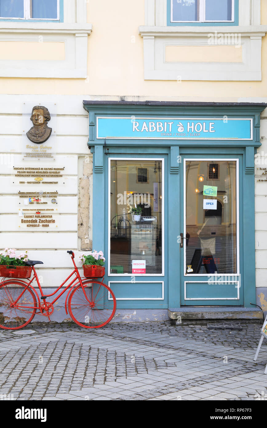 The Rabbit Hole cafe on lovely Piata Mare in Sibiu's old town, in Transylvania, Romania Stock Photo