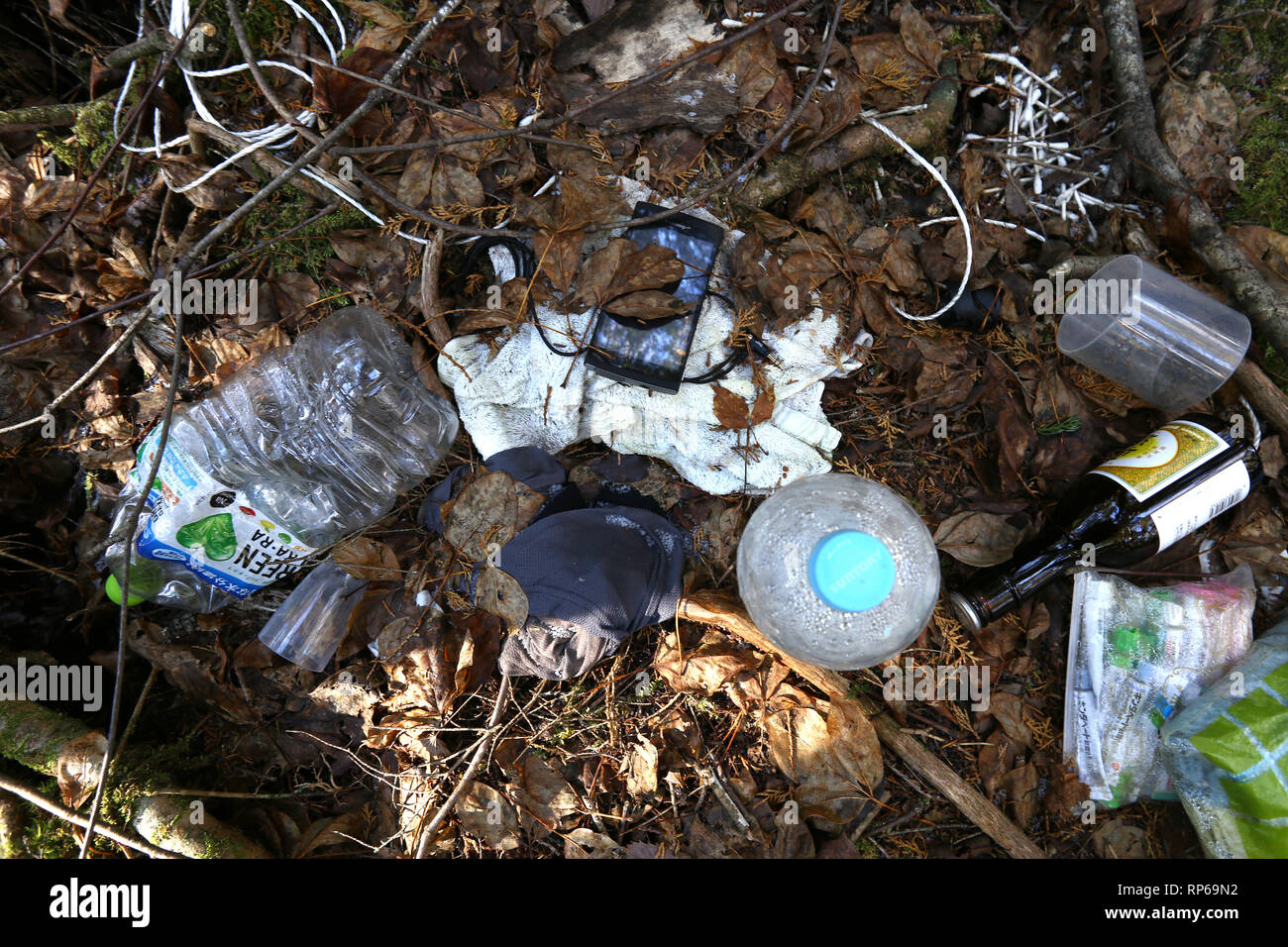 Scattered belongings on the floor of the Aokigahara suicide forest in Tokyo, Japan Stock Photo