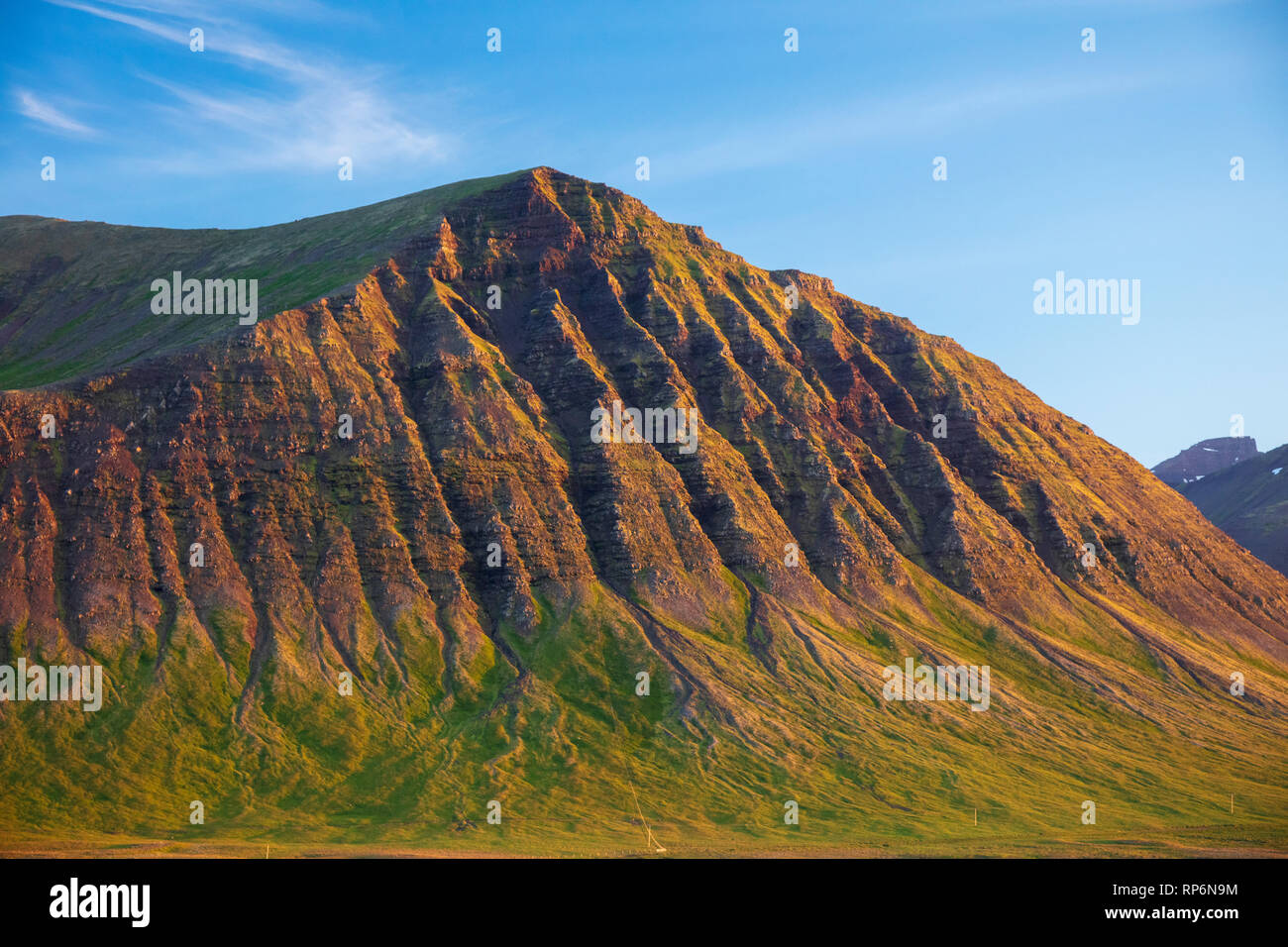 Erosion gullies define a mountain near Pingeyri, Westfjords, Iceland. Stock Photo