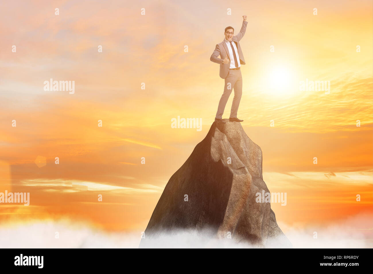 Businessman at the top of mountain Stock Photo - Alamy