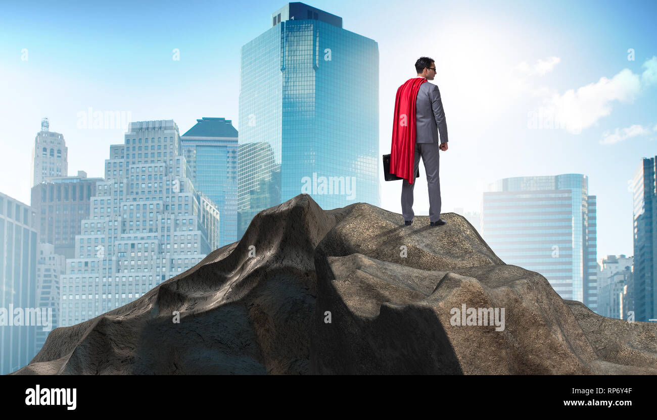 Superhero businessman on top of mountain Stock Photo - Alamy