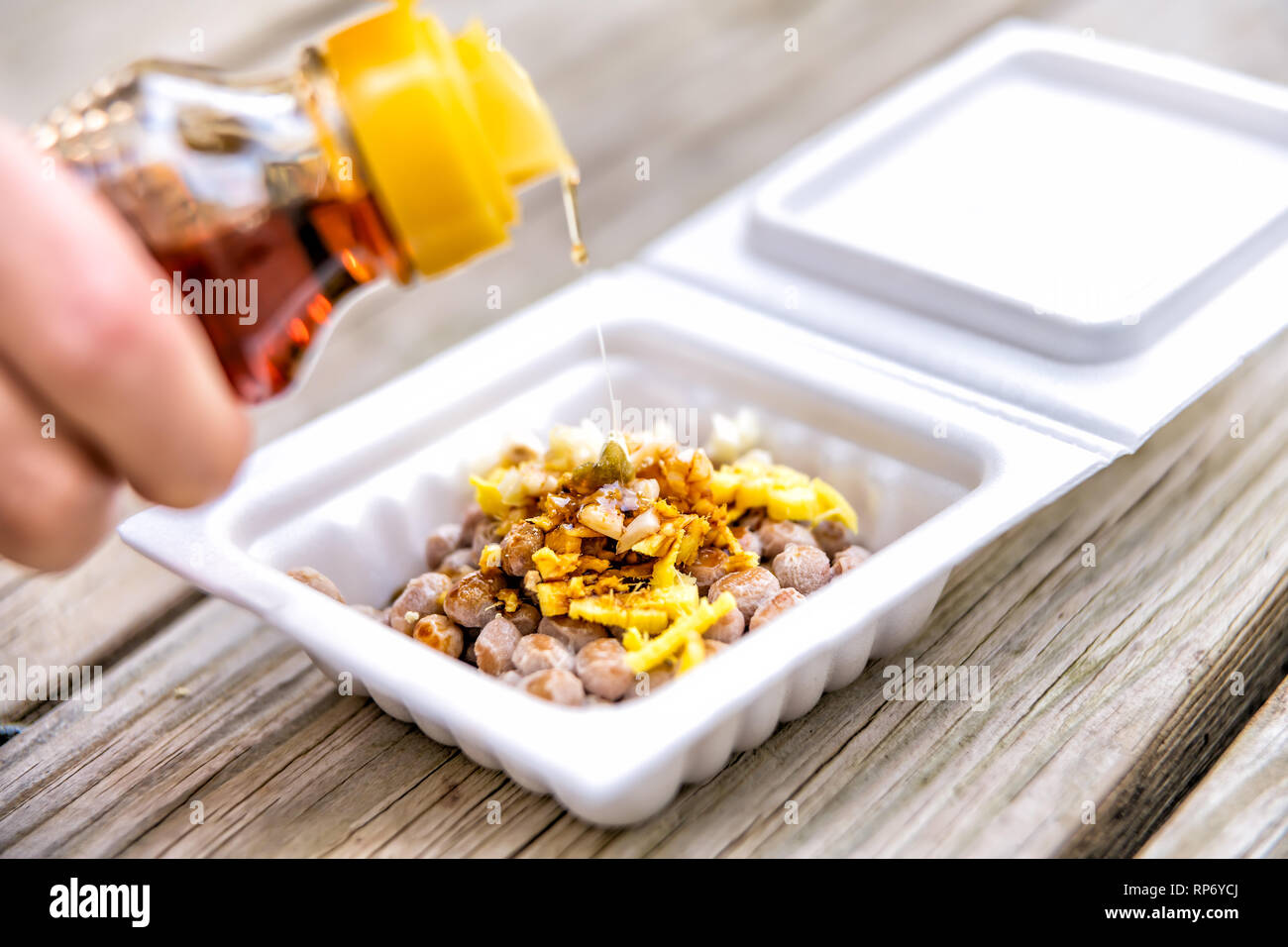 Asian Japanese natto fermented soy dish meal in styrofoam container Japan box closeup and