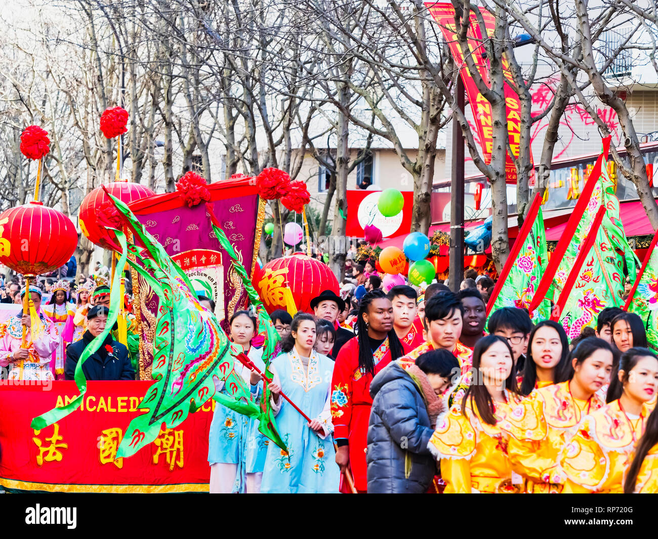 PARIS, FRANCE - FEBRUARY 17, 2019. Last day of the chinese new year celebration festival in street. People dragon lion dancing show colorful costumes. Stock Photo