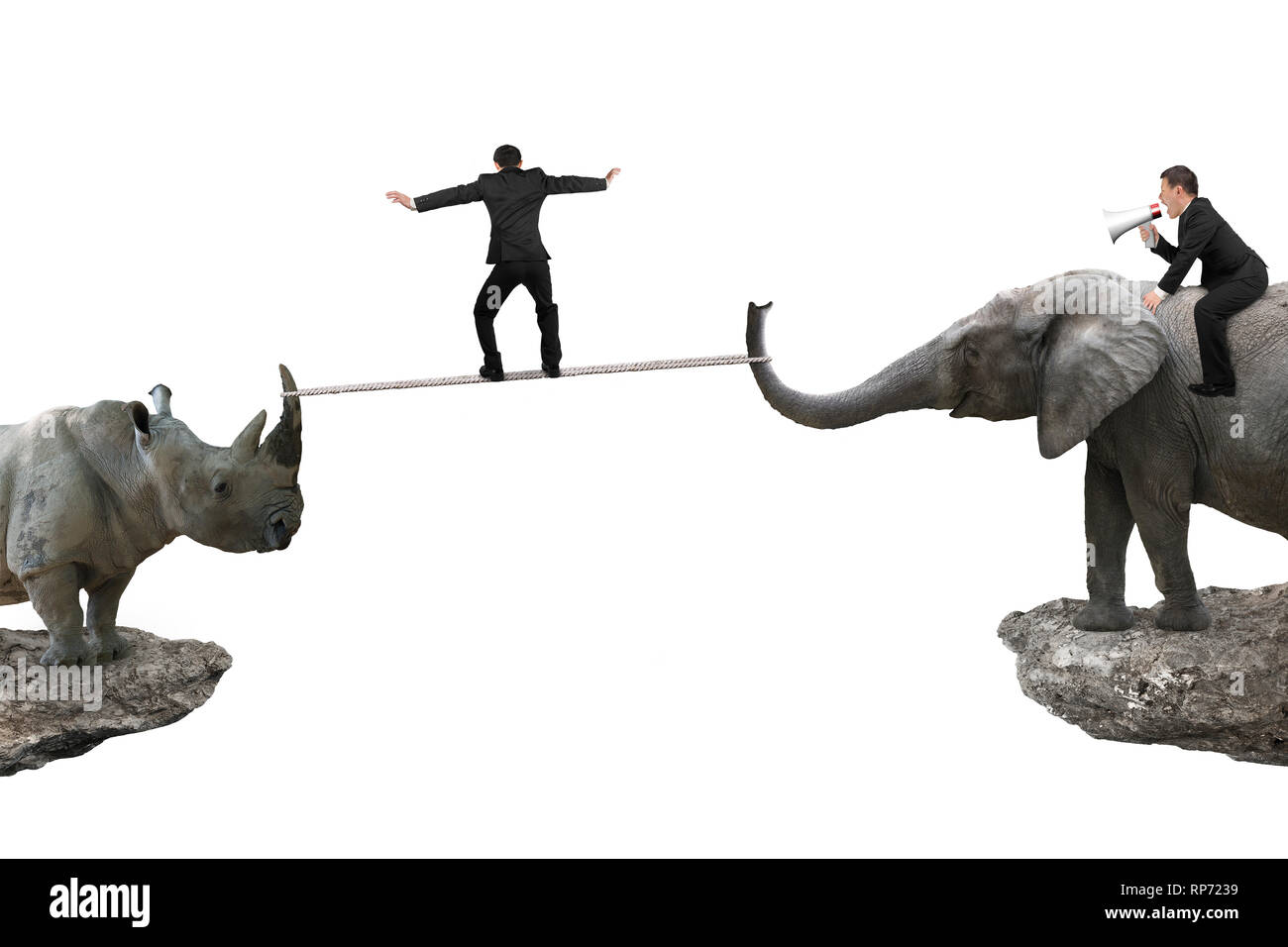 One man riding elephant against rhinoceros with another man balancing rope on two cliffs