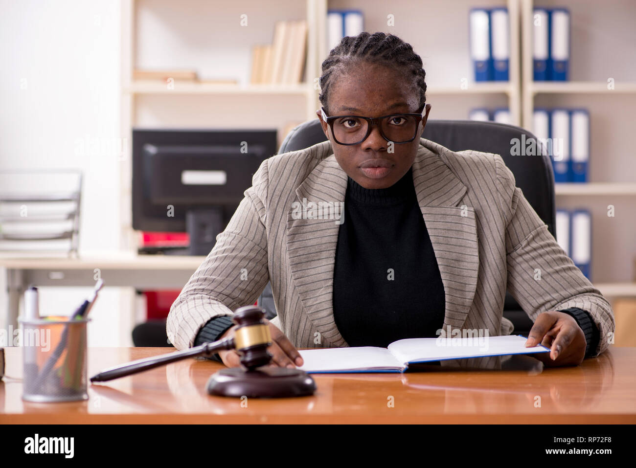 Black female lawyer in courthouse Stock Photo - Alamy