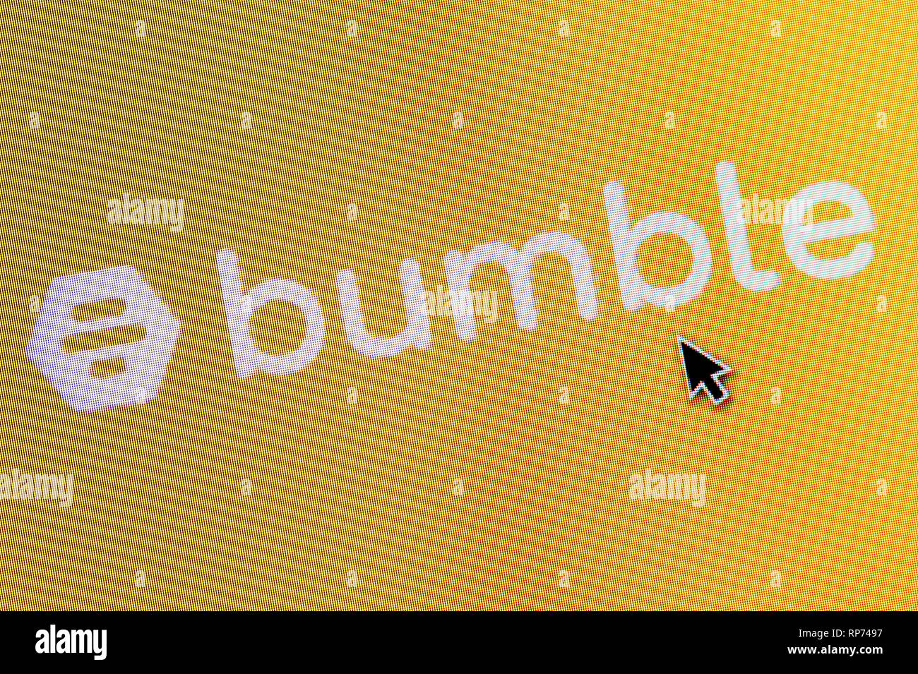 The logo of Bumble is seen on a computer screen along with a mouse cursor (Editorial use only) Stock Photo