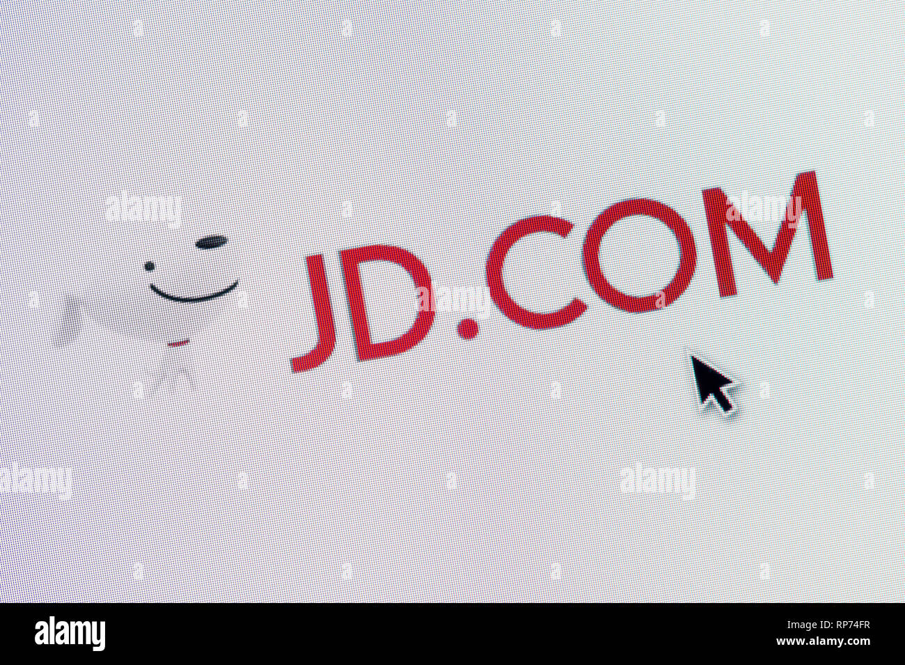 The logo of JD.com (Jingdong) is seen on a computer screen along with a mouse cursor (Editorial use only) Stock Photo