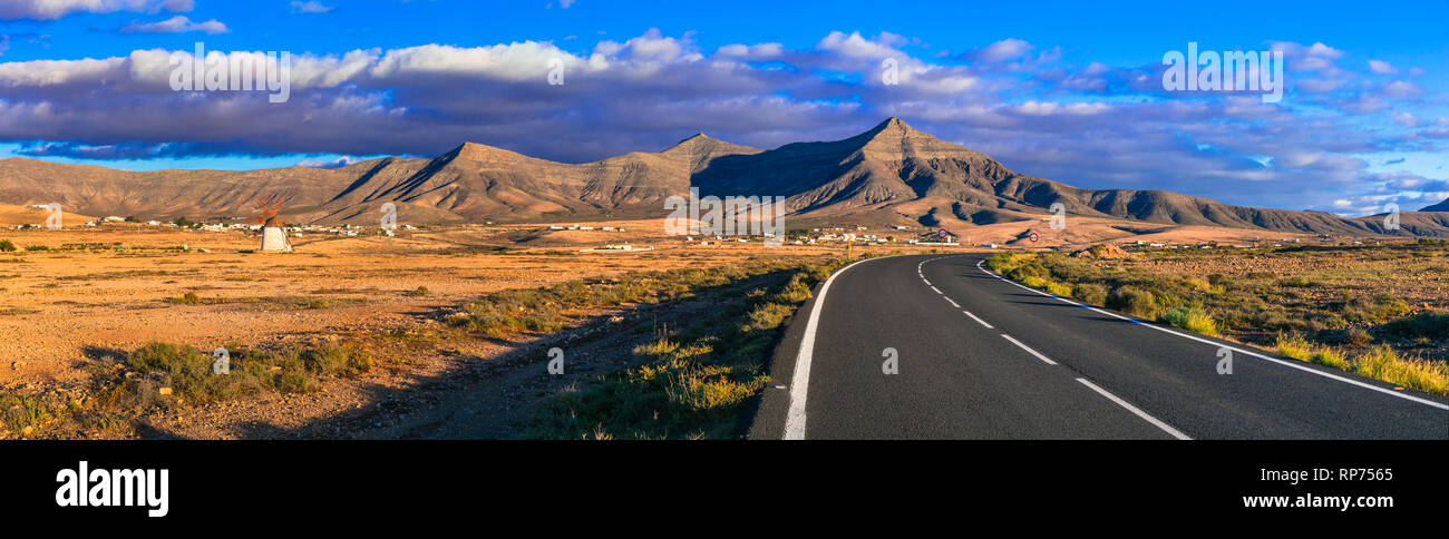 Fuerteventura travel - scenic landscapes of volcanic island, view with traditional windmill. Canary islands Stock Photo