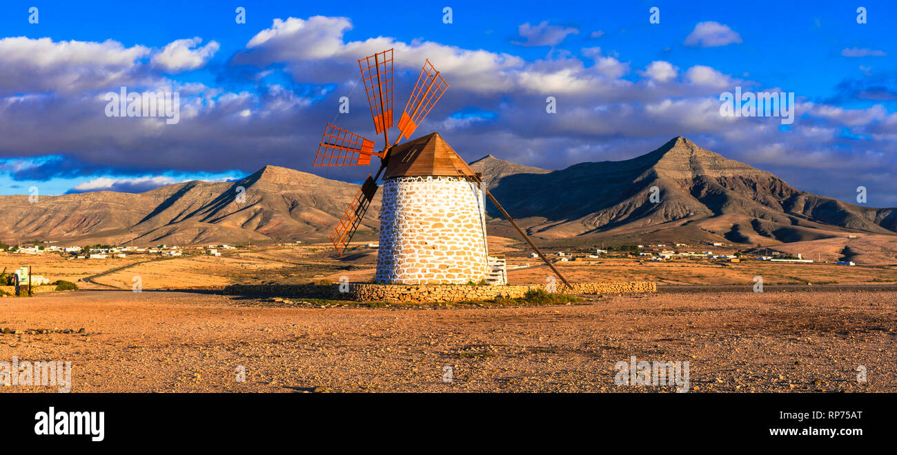Fuerteventura travel - scenic landscapes of volcanic island, view with traditional windmill. Canary islands Stock Photo