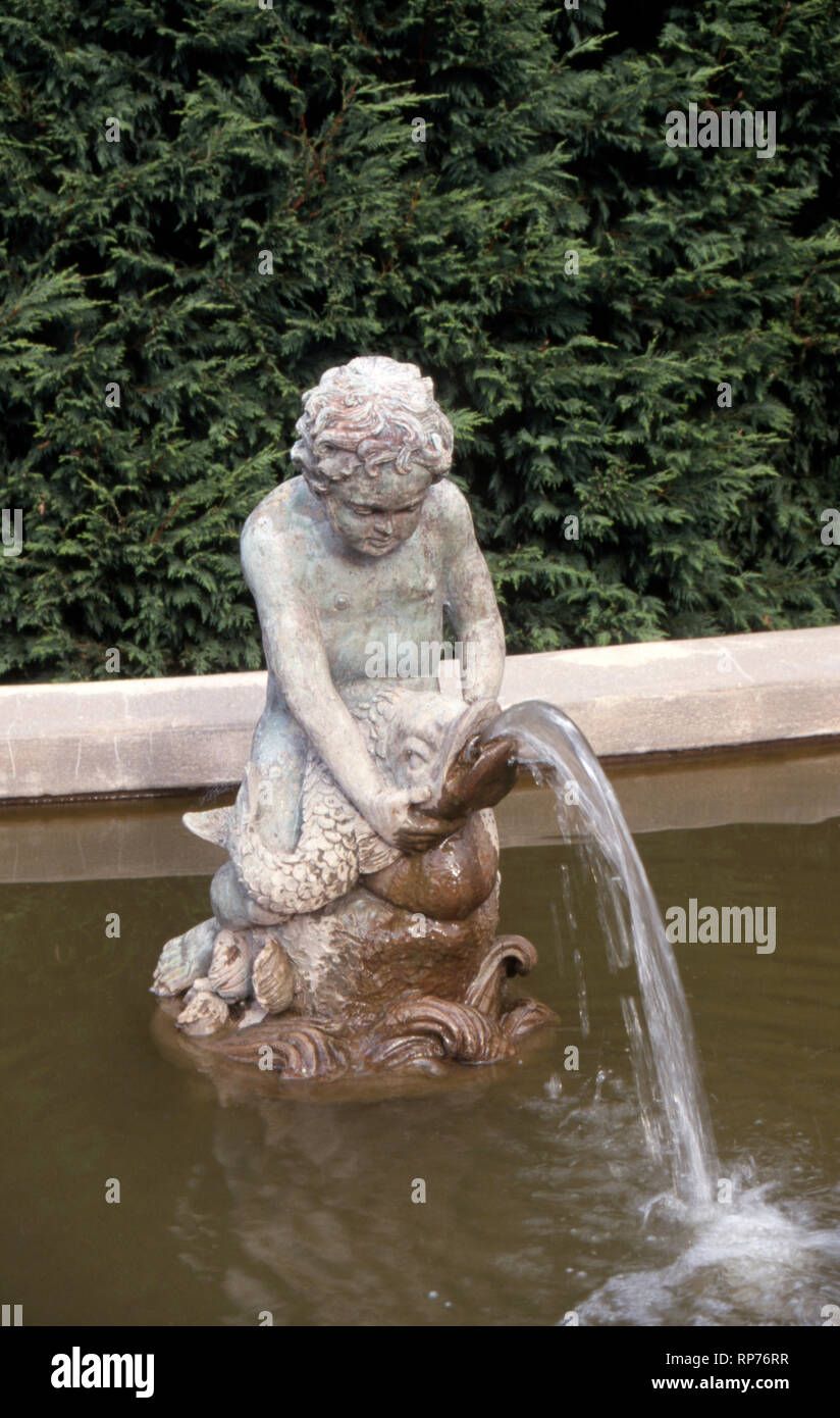 ORNATE GARDEN FOUNTAIN OF YOUNG BOY SITTING ON A LARGE FISH, BLUE