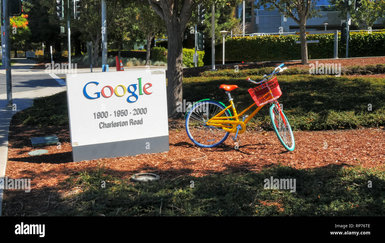 MOUNTAIN VIEW, CA, USA - AUGUST 28, 2015: close up of a google sign and bicycle outside google headquarters building. Stock Photo