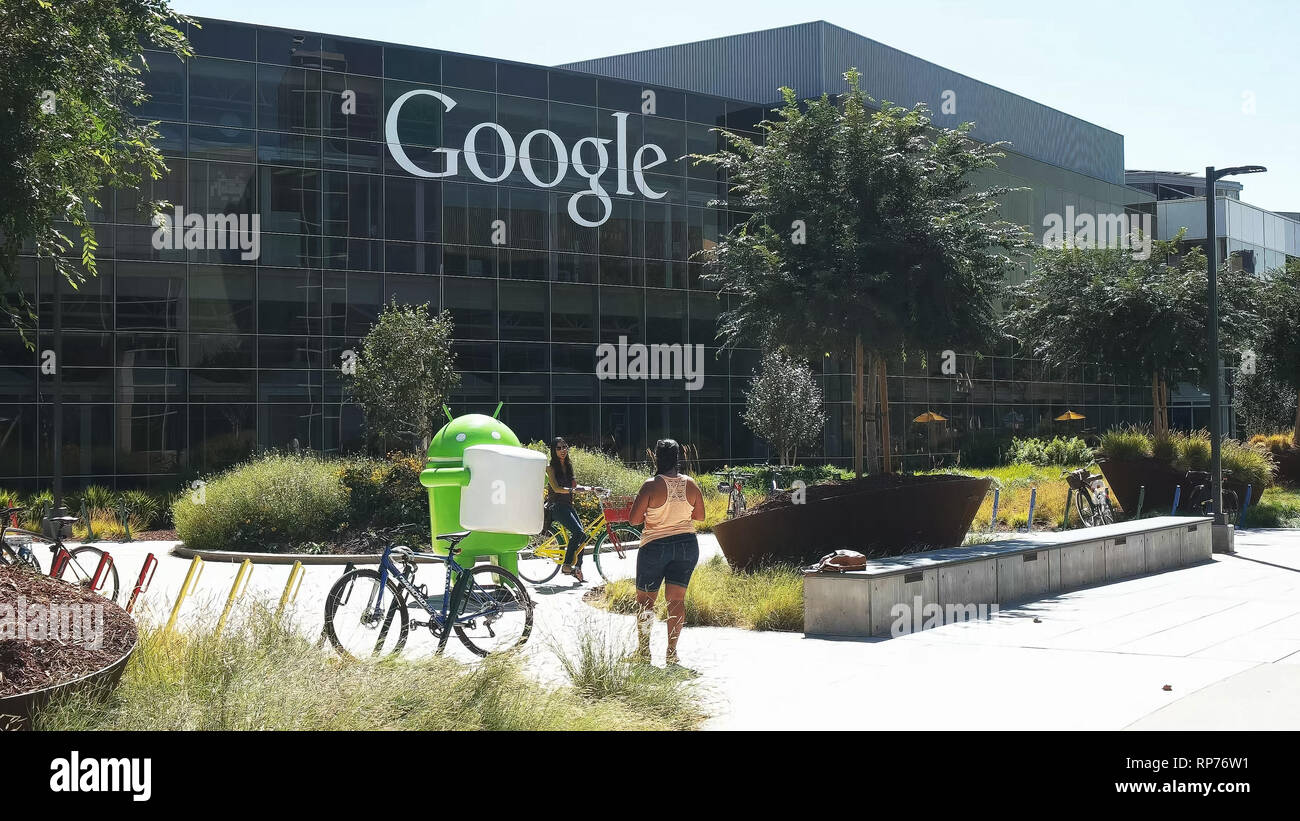MOUNTAIN VIEW, CA, USA - AUGUST 28, 2015: visitors pose for photos at the google headquarters building in california. Stock Photo
