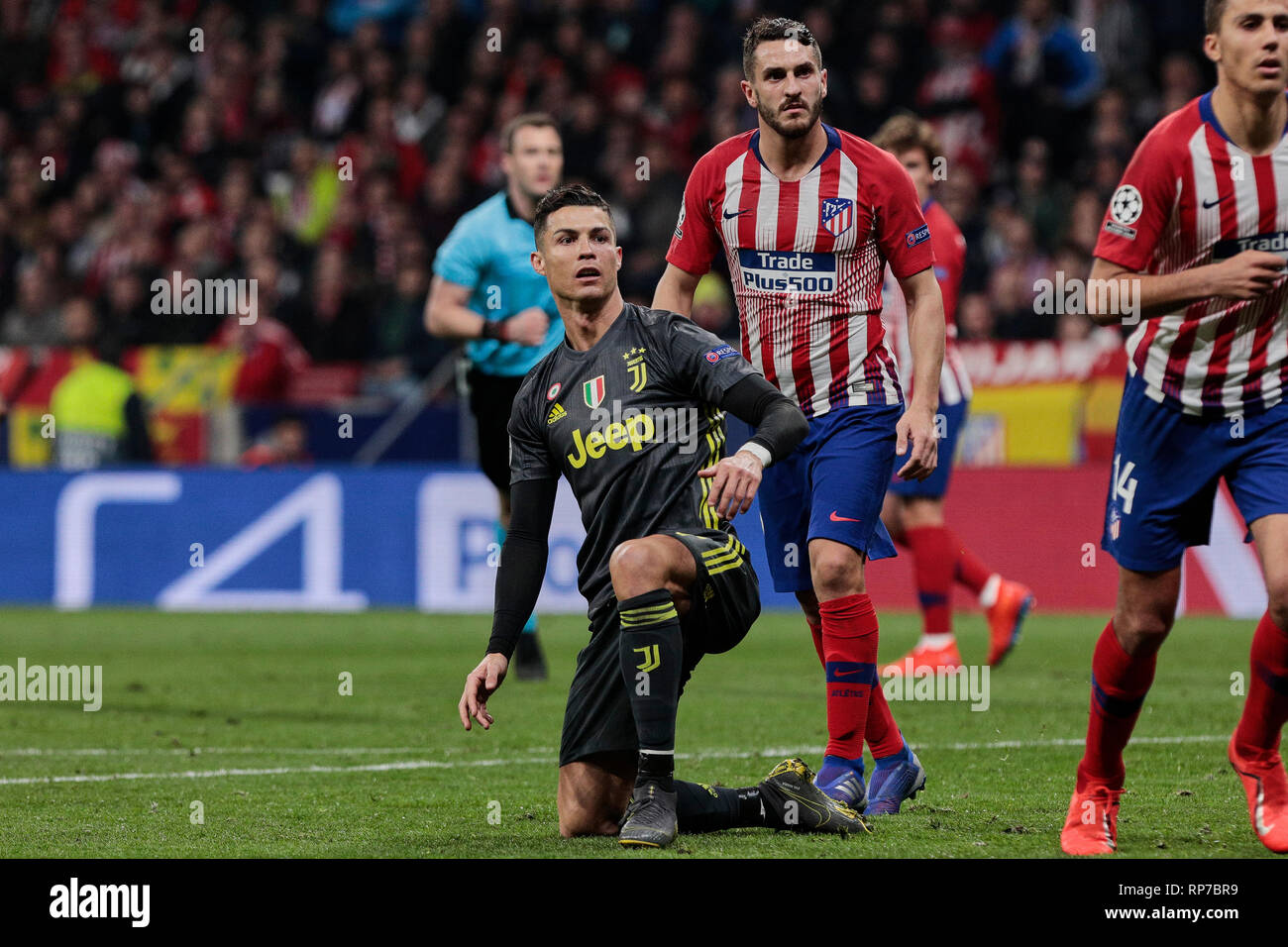 Atletico de Madrid's Koke Resurreccion (L) and Rodrigo Hernandez (R) and Juventus' Cristiano Ronaldo seen in action during the UEFA Champions League match, Round of 16, 1st leg between Atletico de Madrid and Juventus at Wanda Metropolitano Stadium in Madrid, Spain. Stock Photo