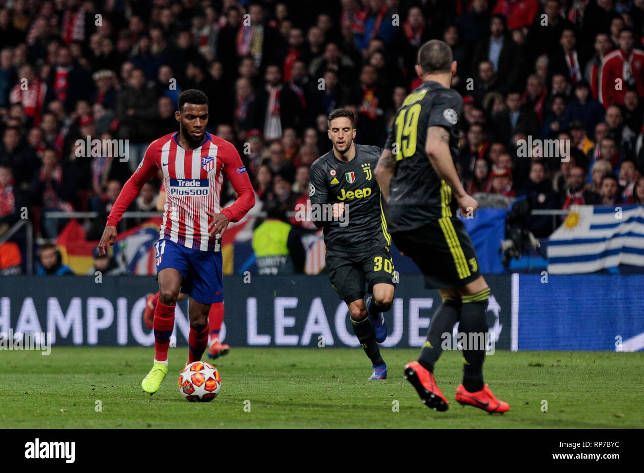 Atletico de Madrid's Thomas Lemar and Juventus' Rodrigo Betancur seen in action during the UEFA Champions League match, Round of 16, 1st leg between Atletico de Madrid and Juventus at Wanda Metropolitano Stadium in Madrid, Spain. Stock Photo
