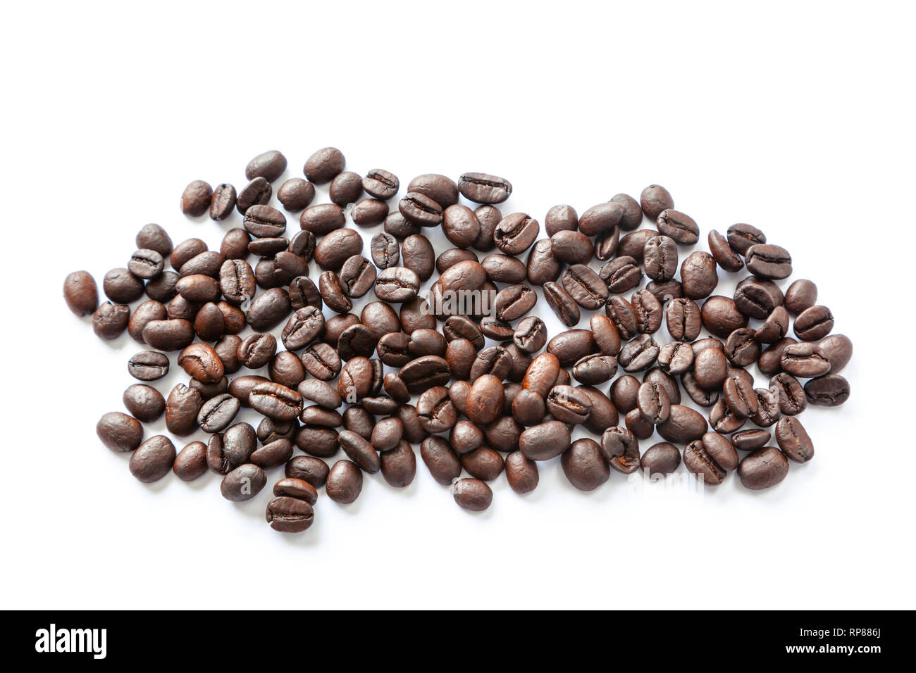 Dark roasted coffee beans, isolated on white background Stock Photo - Alamy