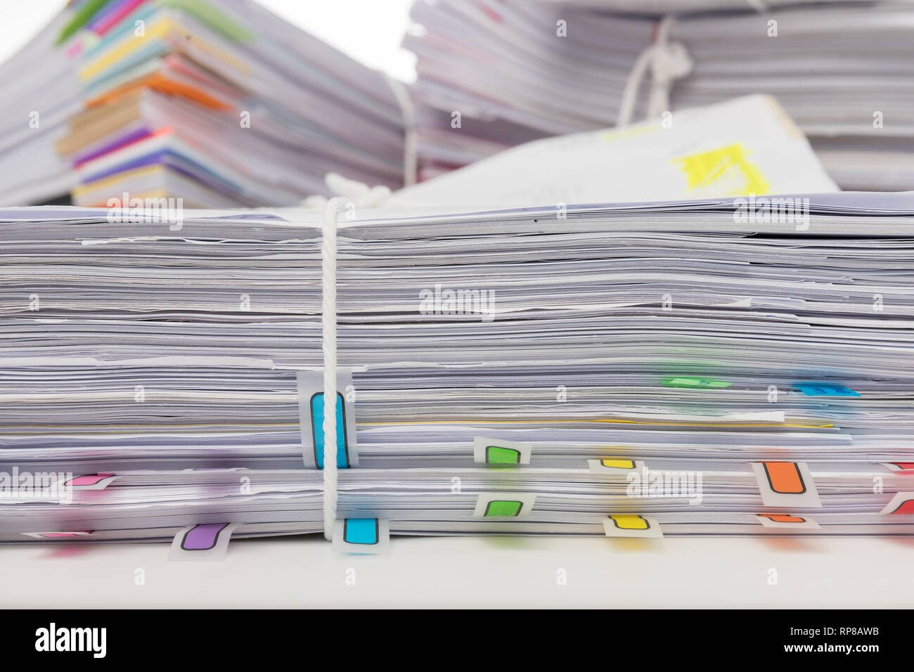 Stack of business papers isolated on white background Stock Photo - Alamy