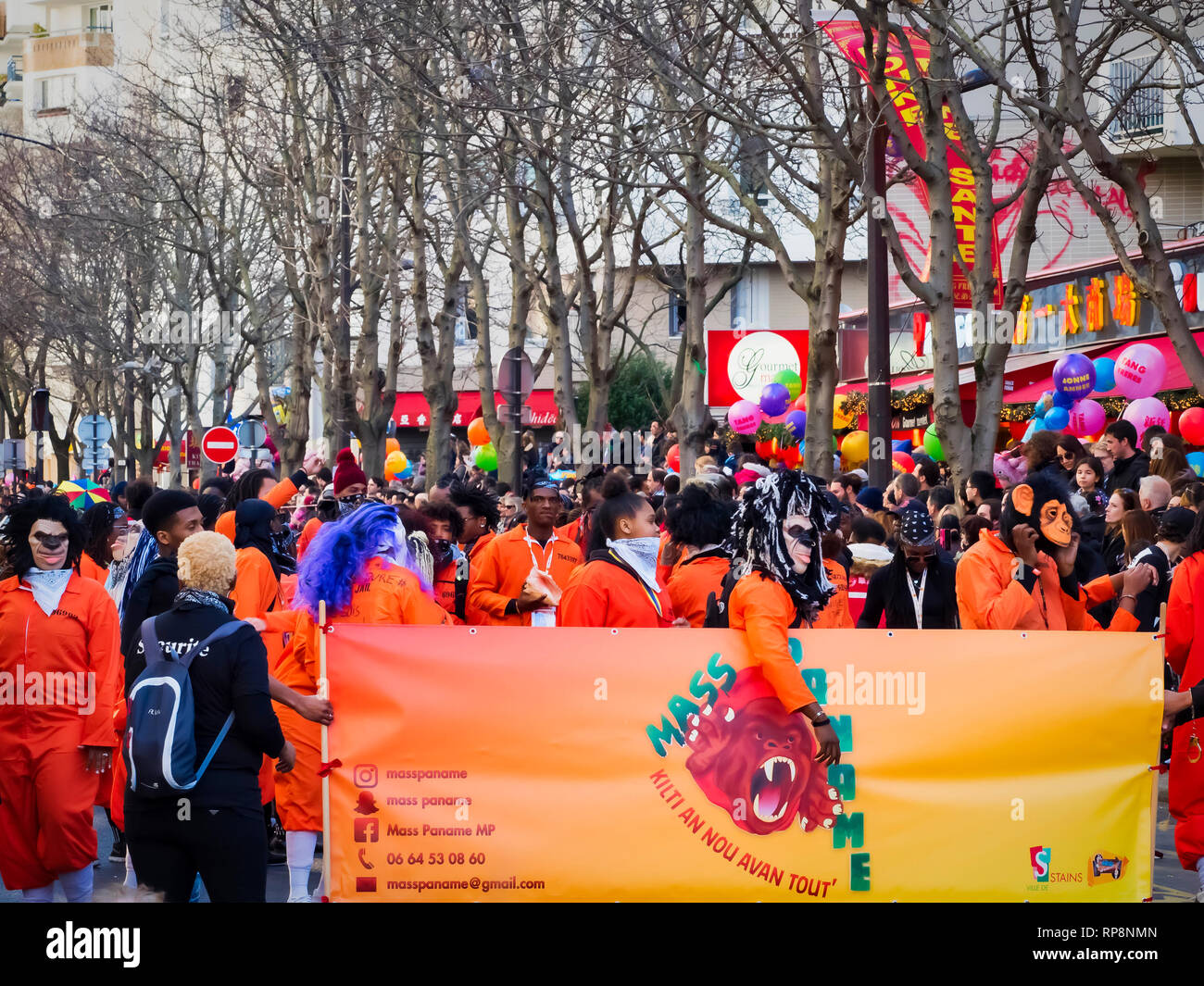 PARIS, FRANCE - FEBRUARY 17, 2019. Last day of the chinese new year celebration festival in street. People dragon lion dancing show colorful costumes. Stock Photo
